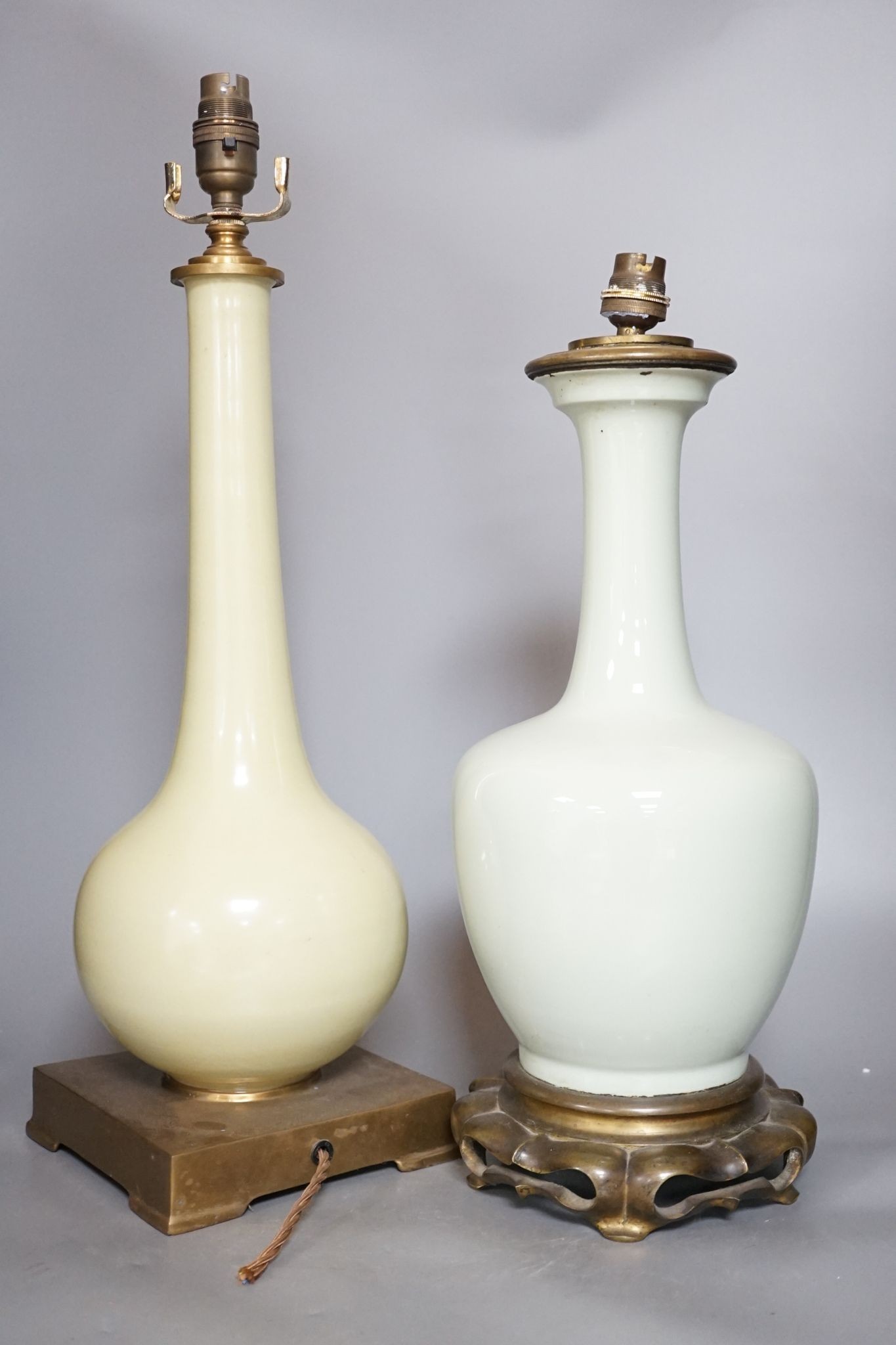 Two Chinese celadon glazed converted lamps, 44cm